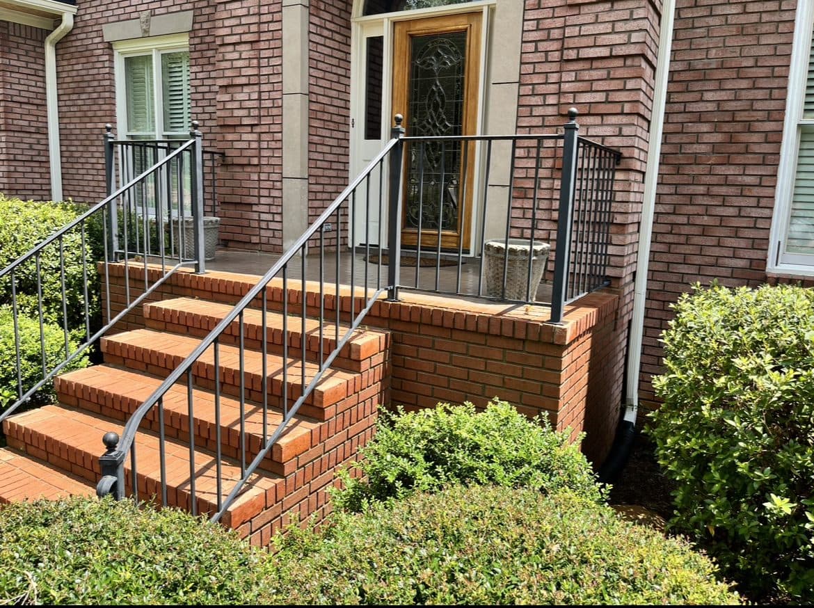 Brick front steps and iron railing after a house wash, Birmingham metro