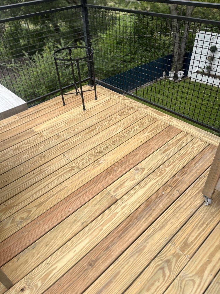 Gray wood deck being cleaned back to its colour in Birmingham, Alabama