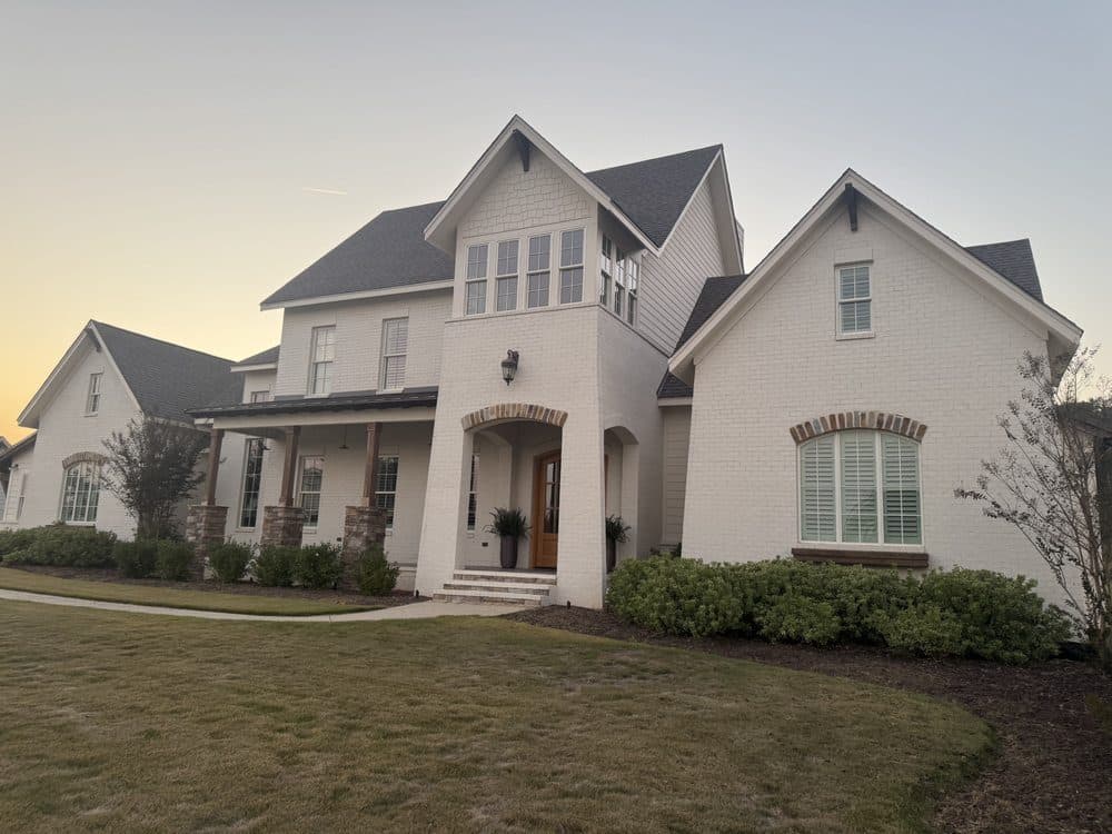 White brick two story home after a house wash, Birmingham metro