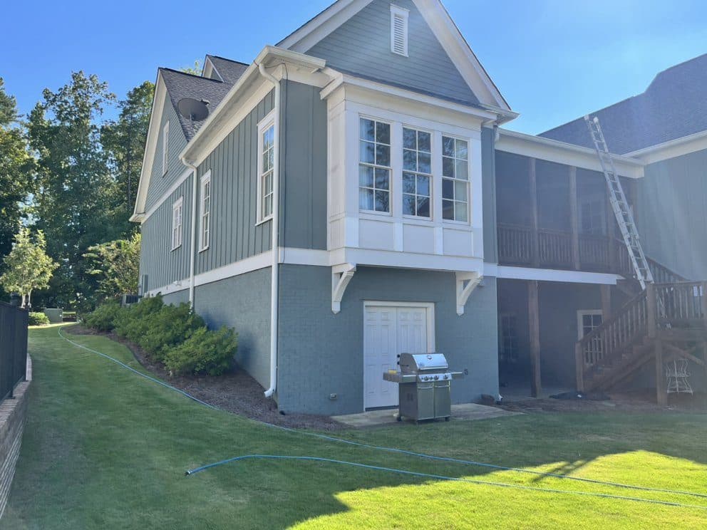 Soft washing vinyl siding on a two story home in Birmingham, Alabama