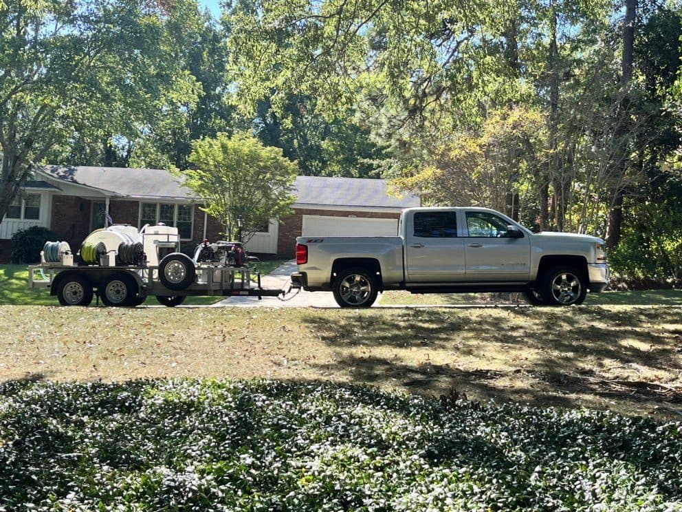 The truck and pressure washing trailer at a brick ranch, Birmingham metro