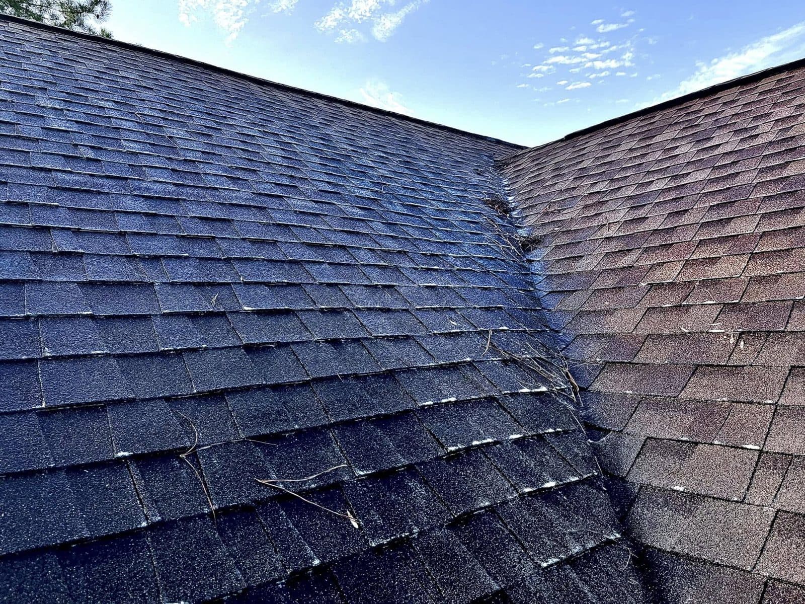 Shingle roof half cleaned, dirty side and clean side meeting at the valley, Birmingham metro